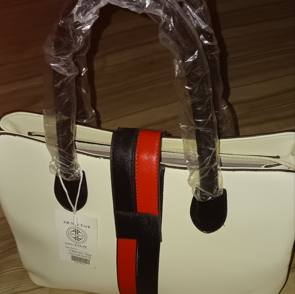 White bag with red/black striped snaps